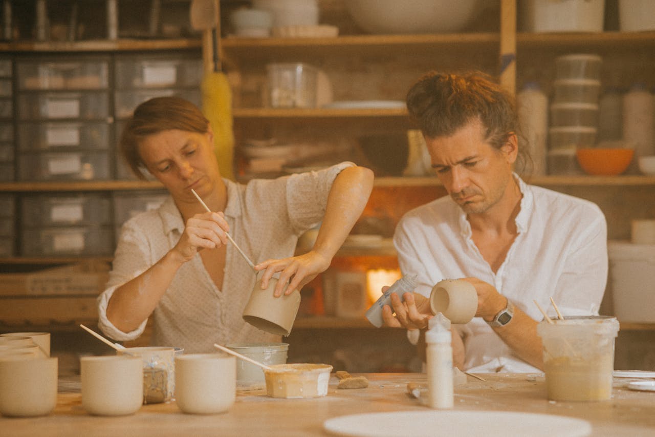 pexels-photo-9736921 Two adults crafting ceramics in a creative studio workspace.